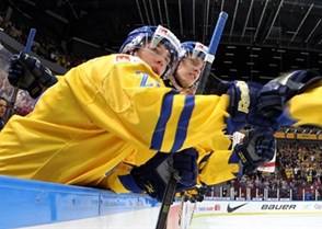 MALMO, SWEDEN - DECEMBER 31: Sweden's Oskar Sundqvist #29 celebrates at the bench after Sweden took a 1-0 lead over Russia in preliminary round action at the 2014 IIHF World Junior Championship. (Photo by Andre Ringuette/HHOF-IIHF Images)